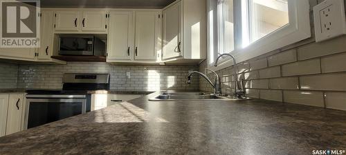 1202 Butterfield Crescent N, Regina, SK - Indoor Photo Showing Kitchen With Double Sink