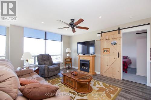 1209 - 711 Rossland Road E, Whitby (Pringle Creek), ON - Indoor Photo Showing Living Room With Fireplace