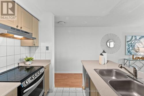 702 - 8 Lee Centre Drive, Toronto, ON - Indoor Photo Showing Kitchen With Double Sink