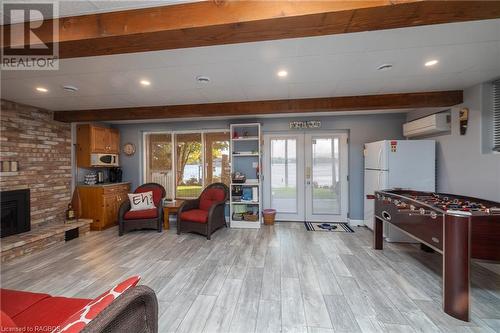 173 Macdonalds Road, Grey Highlands, ON - Indoor Photo Showing Other Room With Fireplace