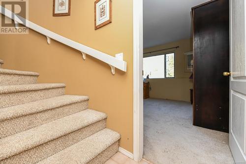 Bottom of staircase - 5594 7Th St, Union Bay, BC - Indoor Photo Showing Other Room