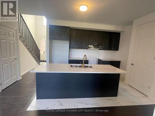 7 Mayapple Street, New Tecumseth, ON - Indoor Photo Showing Kitchen With Double Sink