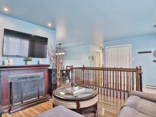 Living room - 24 Rue William, Lanoraie, QC - Indoor With Fireplace