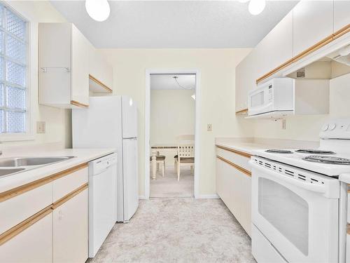 202-2373 Henry Ave, Sidney, BC - Indoor Photo Showing Kitchen With Double Sink