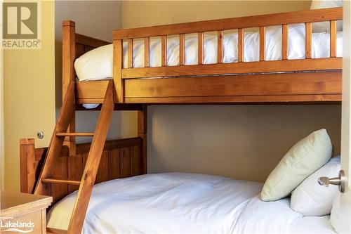 1869 Muskoka Road 118 W Unit# A202-D1, Muskoka Lakes, ON - Indoor Photo Showing Bedroom