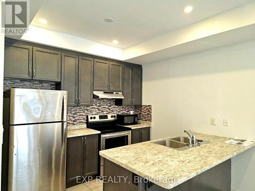 12 - 35 Heron Park Place, Toronto, ON - Indoor Photo Showing Kitchen With Stainless Steel Kitchen With Double Sink With Upgraded Kitchen