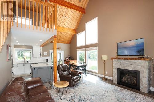 57 Cedar Beach Road, Brock (Beaverton), ON - Indoor Photo Showing Living Room With Fireplace