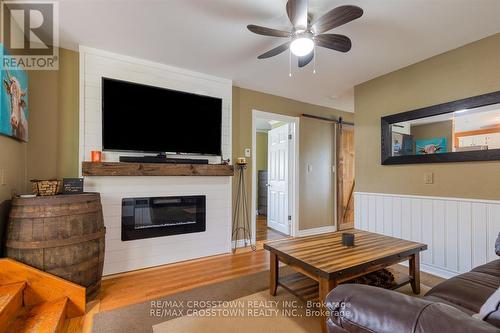 14308 County 27 Road, Springwater, ON - Indoor Photo Showing Living Room With Fireplace