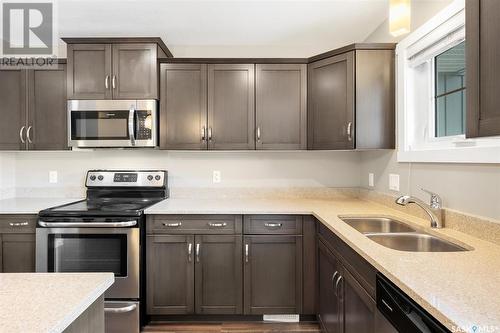 226 1220 Pringle Way, Saskatoon, SK - Indoor Photo Showing Kitchen With Double Sink