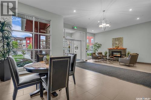 302 1025 Moss Avenue, Saskatoon, SK - Indoor Photo Showing Other Room With Fireplace