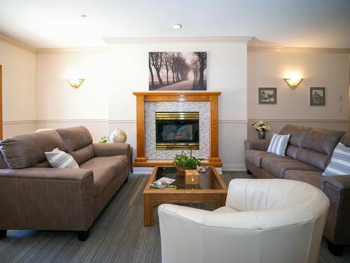 104-3805 30 Avenue, Vernon, BC - Indoor Photo Showing Living Room With Fireplace