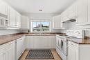 306-680 Doyle Avenue, Kelowna, BC  - Indoor Photo Showing Kitchen With Double Sink 