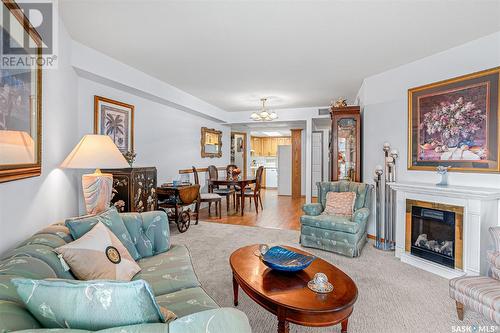 232 2301 Adelaide Street E, Saskatoon, SK - Indoor Photo Showing Living Room With Fireplace