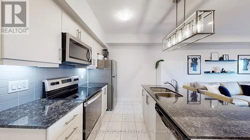 512 - 4 Spice Way, Barrie, ON - Indoor Photo Showing Kitchen With Double Sink With Upgraded Kitchen