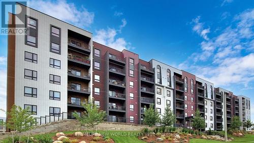 512 - 4 Spice Way, Barrie, ON - Outdoor With Balcony With Facade