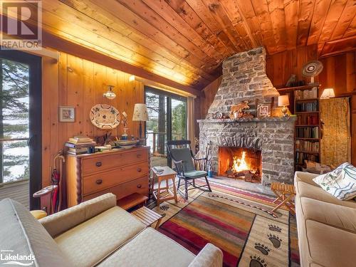 53 Birdwood Drive, Mcdougall, ON - Indoor Photo Showing Living Room With Fireplace