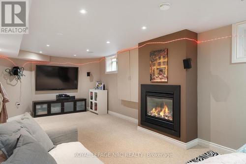 8829 Joseph Court, Niagara Falls, ON - Indoor Photo Showing Living Room With Fireplace