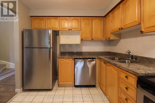 100 - 833 Scollard Court, Mississauga, ON - Indoor Photo Showing Kitchen With Double Sink