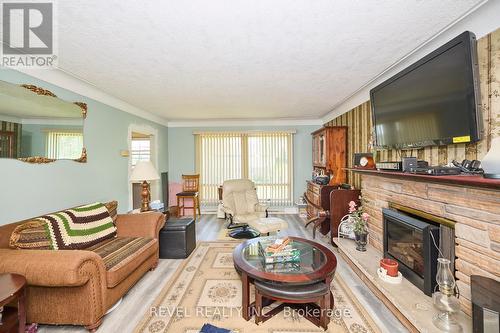 7205 Sharon Avenue, Niagara Falls, ON - Indoor Photo Showing Living Room With Fireplace