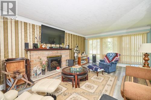 7205 Sharon Avenue, Niagara Falls, ON - Indoor Photo Showing Living Room With Fireplace