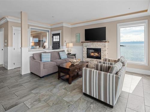 43A-1000 Sookepoint Pl, Sooke, BC - Indoor Photo Showing Living Room With Fireplace