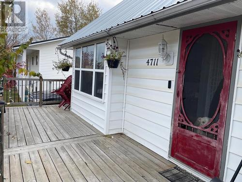 4711 Spruce Avenue, Fort Nelson, BC - Outdoor With Deck Patio Veranda With Exterior