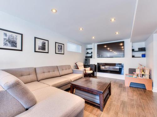 Family room - 771 Rue Du Chardonnay, Laval (Duvernay), QC - Indoor Photo Showing Living Room With Fireplace