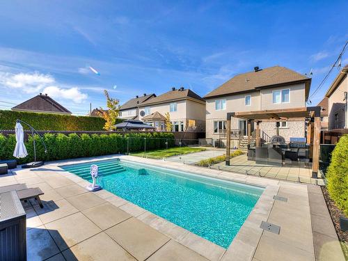 Back facade - 771 Rue Du Chardonnay, Laval (Duvernay), QC - Outdoor With In Ground Pool With Deck Patio Veranda With Backyard