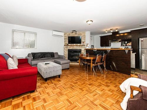 Salle familiale - 8673 Rue Centrale, Montréal (Lasalle), QC - Indoor Photo Showing Living Room With Fireplace