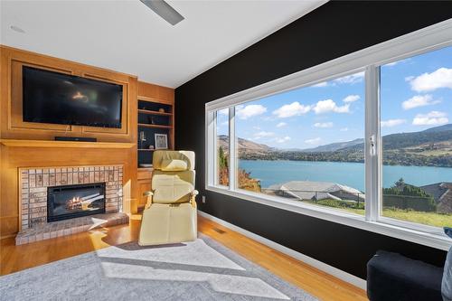 7901 Kalview Drive, Coldstream, BC - Indoor Photo Showing Living Room With Fireplace With Body Of Water