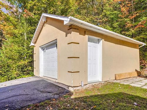 Garage - 135 Rue St-Jean, Saint-Calixte, QC - Outdoor With Exterior