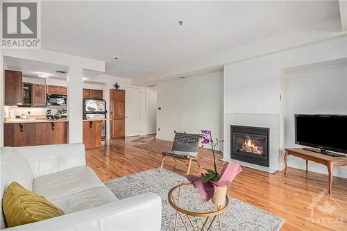 400 Mcleod Street Unit#201, Ottawa, ON - Indoor Photo Showing Living Room With Fireplace