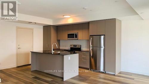 335 - 101 Cathedral High Street, Markham, ON - Indoor Photo Showing Kitchen