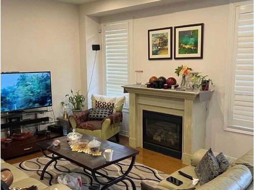 Upper-3884 Bloomington Cres, Mississauga, ON - Indoor Photo Showing Living Room With Fireplace