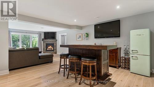 39 Gibbons Street, Norfolk, ON - Indoor Photo Showing Other Room With Fireplace