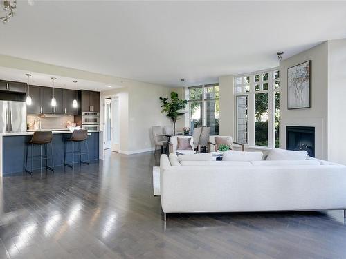 206-999 Burdett Ave, Victoria, BC - Indoor Photo Showing Living Room With Fireplace