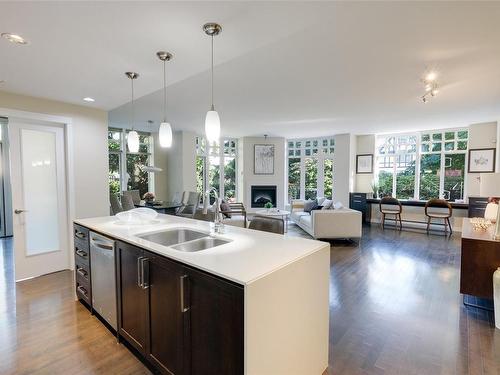 206-999 Burdett Ave, Victoria, BC - Indoor Photo Showing Kitchen With Fireplace With Double Sink With Upgraded Kitchen