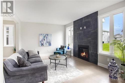 Floor-to-ceiling fireplace surround - 348 Ventoux Avenue, Ottawa, ON - Indoor Photo Showing Living Room With Fireplace