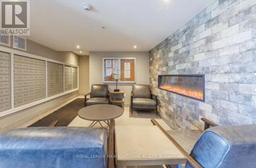 126 - 610 Farmstead Drive, Milton, ON - Indoor With Fireplace