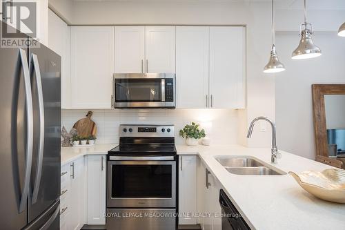 126 - 610 Farmstead Drive, Milton, ON - Indoor Photo Showing Kitchen With Stainless Steel Kitchen With Double Sink With Upgraded Kitchen