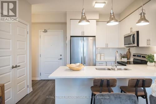 126 - 610 Farmstead Drive, Milton, ON - Indoor Photo Showing Kitchen With Stainless Steel Kitchen With Double Sink With Upgraded Kitchen