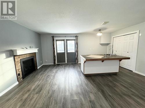 10681 Cottonwood Cresent, Dawson Creek, BC - Indoor Photo Showing Living Room With Fireplace