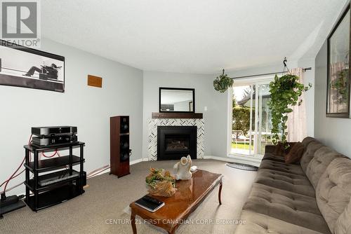 67 - 144 Conway Drive W, London, ON - Indoor Photo Showing Living Room With Fireplace