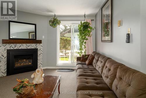 67 - 144 Conway Drive W, London, ON - Indoor Photo Showing Living Room With Fireplace