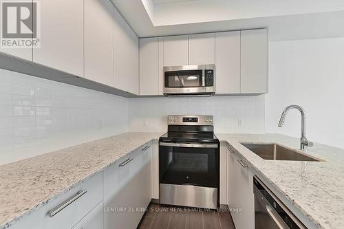 234 - 101 Cathedral High Street, Markham, ON - Indoor Photo Showing Kitchen With Upgraded Kitchen