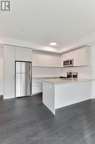 234 - 101 Cathedral High Street, Markham, ON - Indoor Photo Showing Kitchen