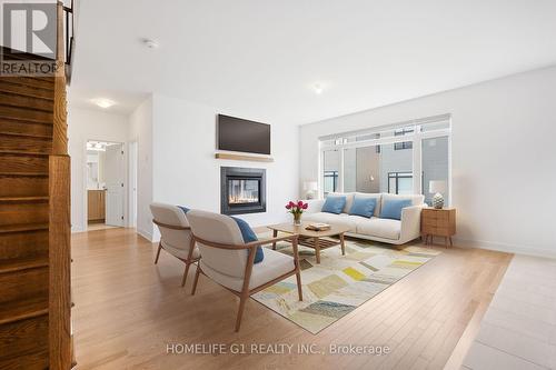 456 Turmeric Court, Ottawa, ON - Indoor Photo Showing Living Room With Fireplace