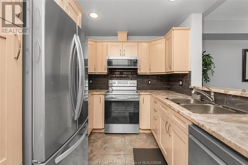 325 Village Grove Unit# 403, St. Clair Beach, ON - Indoor Photo Showing Kitchen With Double Sink