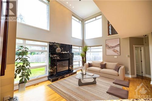 3437 Baskins Beach Road, Ottawa, ON - Indoor Photo Showing Living Room With Fireplace