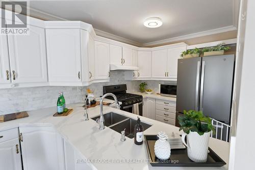 69 Jays Drive, Whitby (Williamsburg), ON - Indoor Photo Showing Kitchen With Double Sink